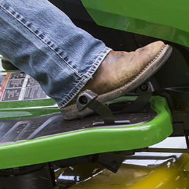 Forward speed control pedal in use