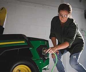 Customer-provided extension cord used to charge mower